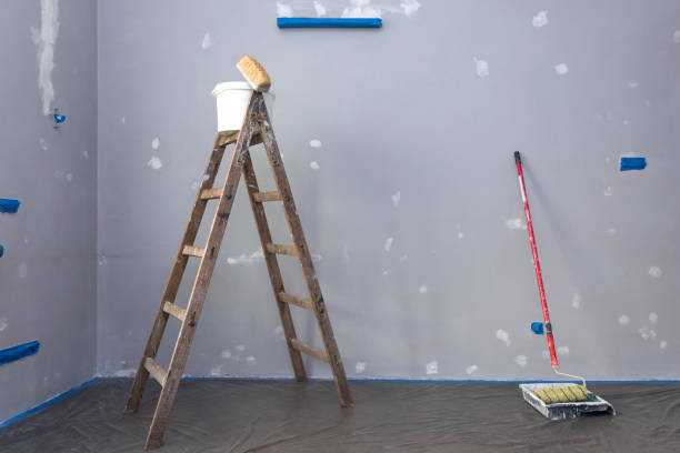 istock Ladder, roller and buckets, home renovation 1181037780