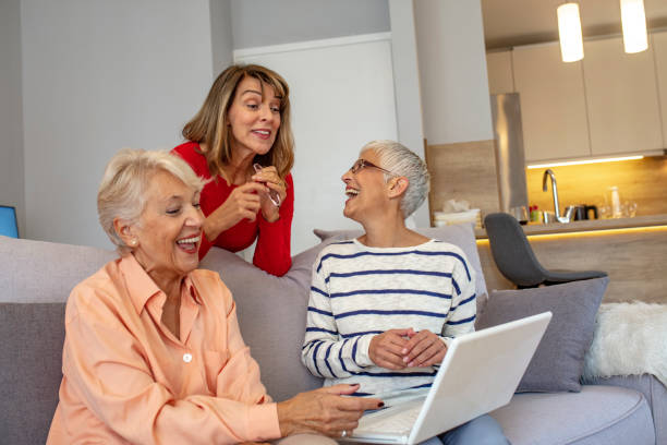 Happy Senior Women Learning Computer Together.