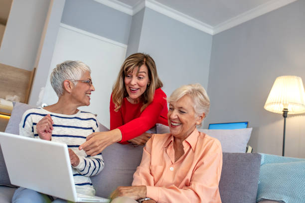 istock Happy Senior Women Learning Computer Together. 1181039715
