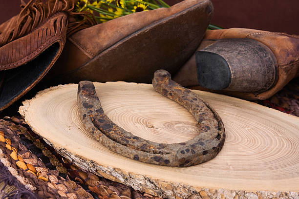 istock Rusty Horseshoe and Cowboy Boots 118104119