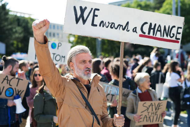 istock People with placards and posters on global strike for climate change. 1181042269