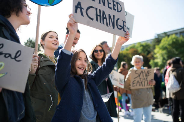 istock People with placards and posters on global strike for climate change. 1181042341