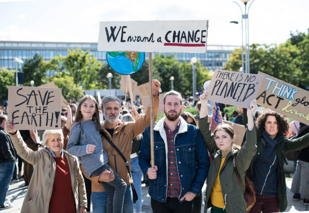 istock People with placards and posters on global strike for climate change. 1181042369