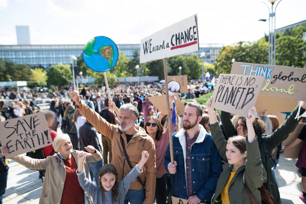 istock People with placards and posters on global strike for climate change. 1181042403