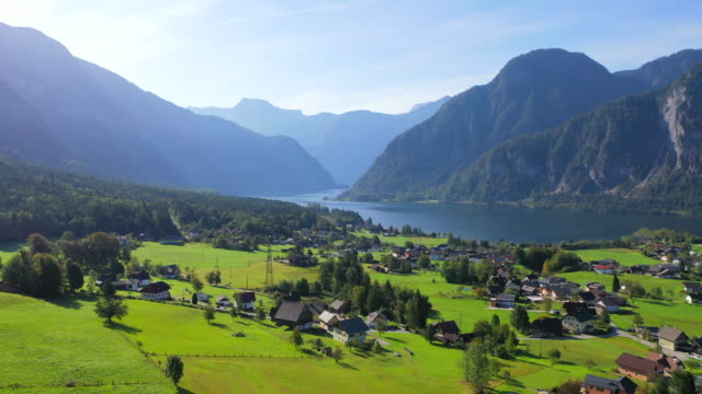 Aerial Drone Movie of Village, mountain and Lake around Hallstatt Village, Austrian Alps, Upper Austria, Europe
