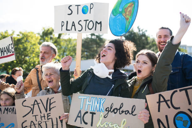 istock People with placards and posters on global strike for climate change. 1181043667