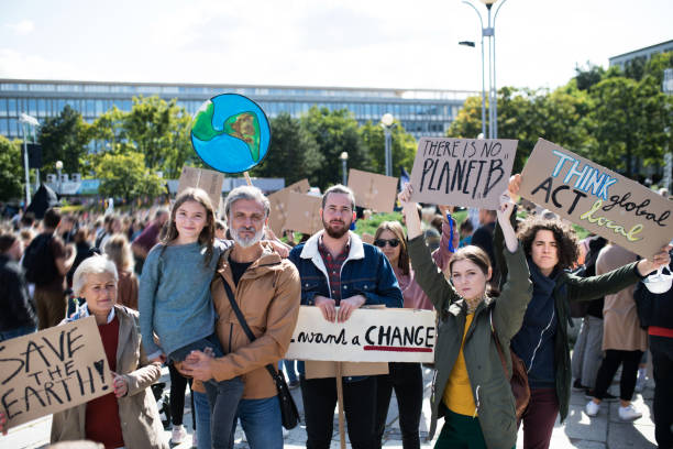 istock People with placards and posters on global strike for climate change. 1181043693