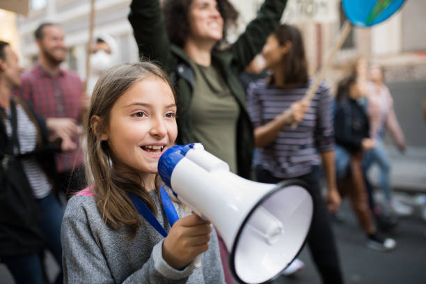 small child with amplifier on global strike for climate change. - environmental damage audio imagens e fotografias de stock