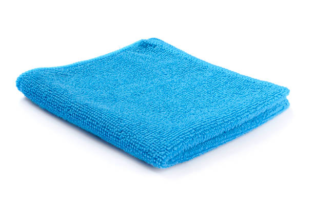 istock Blue beach towel on a white background with shadow. Towel isolated on a white background. Folded beach towel in blue. Summer vacation concept. 1181044850