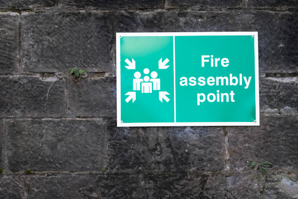 istock Fire assembly point sign at workplace car park 1181045383