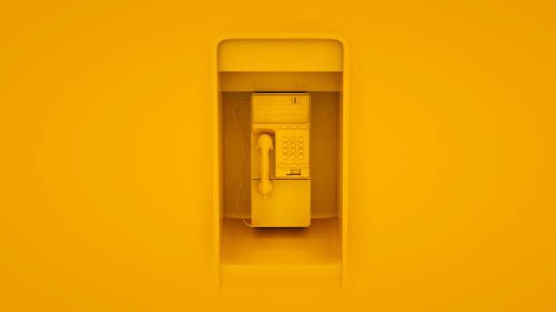 общественный payphone изолированы на желтом фоне. 3d иллюстрация - coin operated pay phone telephone communication стоковые фото и изображения