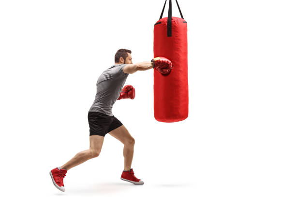 istock Young muscular man training box with a punching bag 1181046903
