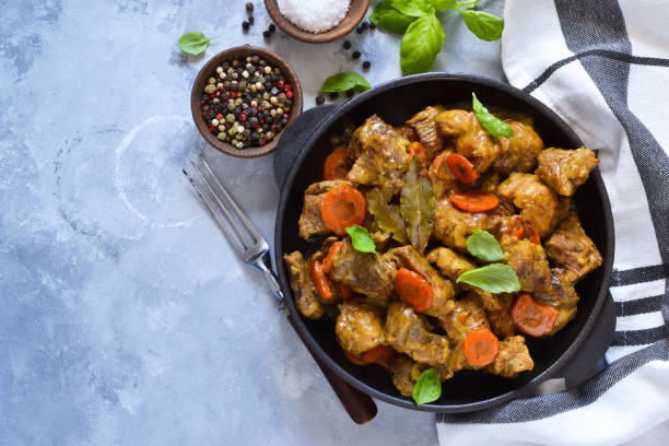 istock Stew with spices in a pan on a concrete background. View from above. 1181047602