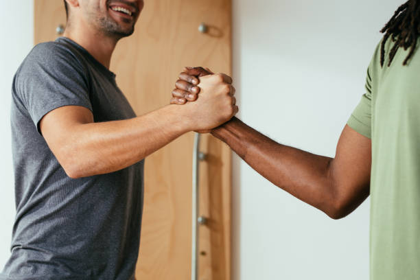 istock Sportsmen Cheering Each Other at Gym 1181054837