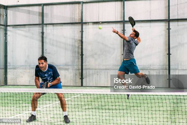 Men Playing Padel Stock Photo - Download Image Now - Padel, Motion, Sports Court