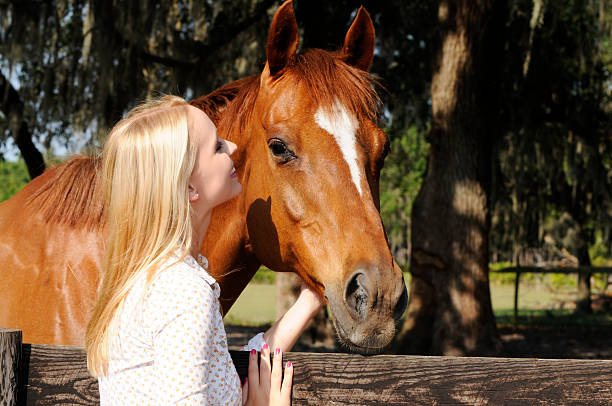 istock Girl smiling at her Stallion 118105560