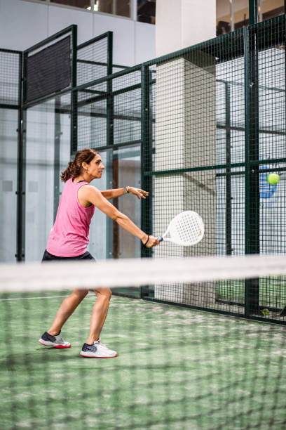 istock woman playing padel 1181056597