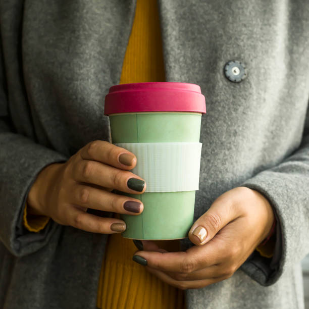 istock Modern coffee cup in the concept of zero waste in a woman's hands 1181056672