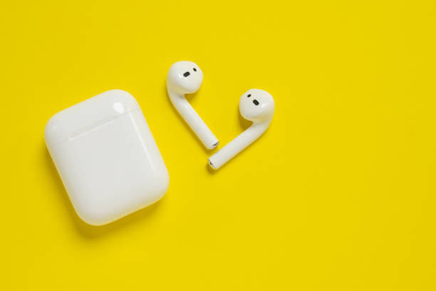 Apple AirPods wireless Bluetooth headphones and charging case for  Apple iPhone. New Apple Earpods Airpods in box. stock photo