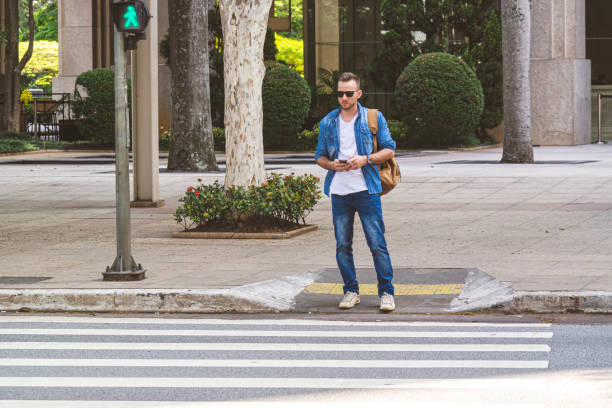istock Young man waiting for taxi 1181063562