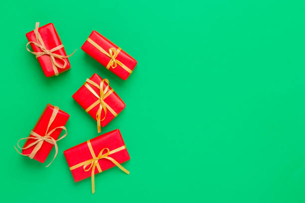istock Christmas Gift Boxes Placed On Green Background 1181065139