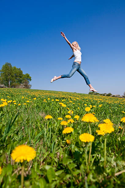 istock happy young woman on meadow 118106539