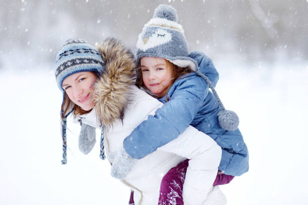 istock Young mother and her daughter on winter 1181066909
