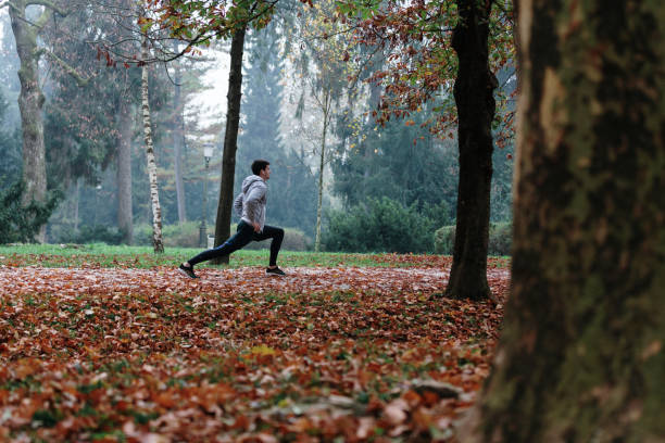 istock Autumn run in the park 1181067150