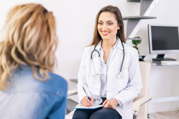istock Female doctor talking with a patient 1181067789