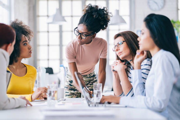 istock Multi-Ethnic women business team having discussion new projects 1181067993
