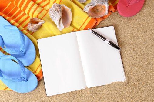 Beach background with towel, flip flops and blank writing book (studio shot - directional lighting and warm color are intentional).  For my complete collection of beach scenes please  CLICK HERE..  Alternative version of this file shown below: