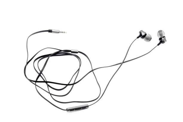 istock Wired headphones in black on a white background. View from above 1181081156
