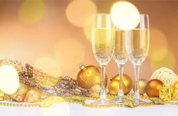 Glasses of champagne and Christmas balls, New Year celebration concept