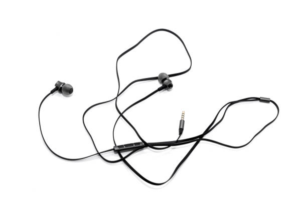 istock Wired headphones in black on a white background. View from above 1181082355