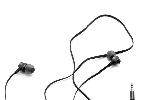 istock Wired headphones in black on a white background. View from above 1181082530