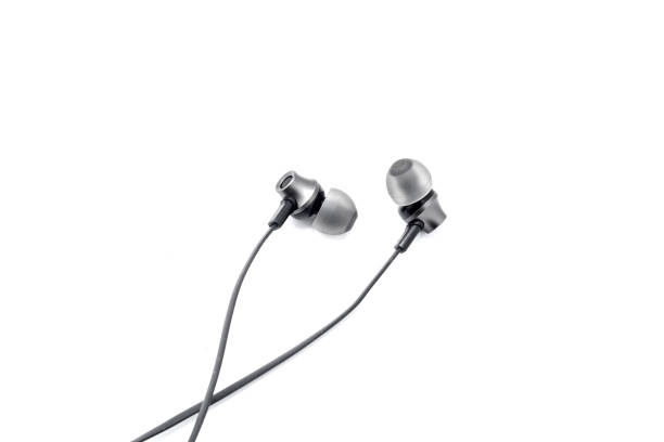 istock Wired headphones in black on a white background. View from above 1181083505