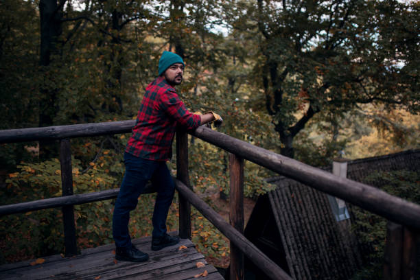 istock Lumberjack resting after work in his cabin 1181090881