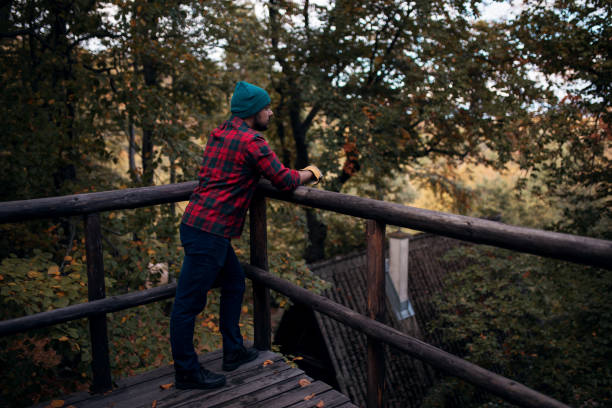 istock Lumberjack resting after work in his cabin 1181092164