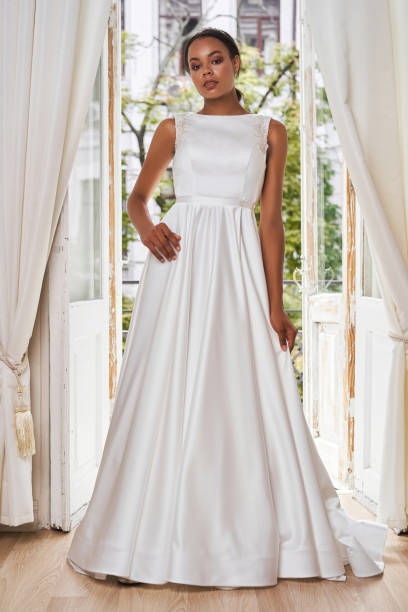 istock Dark-skinned bride posing in a wedding dress 1181092282