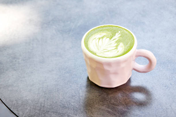 istock Ceramic cup of matcha latte on grey background 1181100851