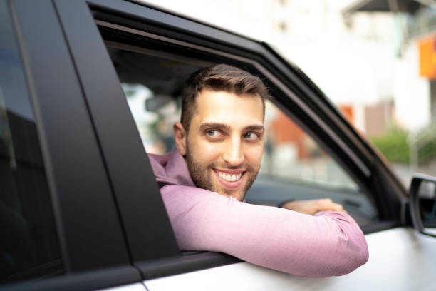 istock Young businessman looking at the view inside the car 1181105173