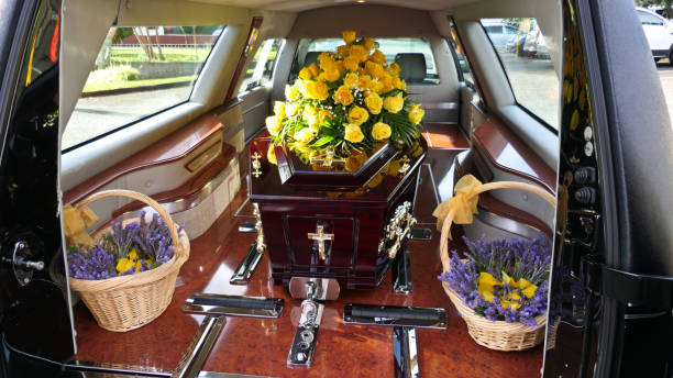 closeup shot of a funeral casket in a hearse or chapel or burial at cemetery closeup shot of a funeral casket in a hearse or chapel or burial at cemetery hearse photos stock pictures, royalty-free photos & images