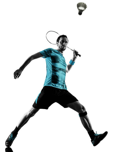 istock Badminton player man shadow silhouette isolated white background 1181107434