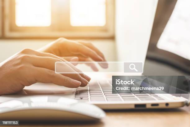 Searching Information Data On Internet Networking Concept Hand Of Male Typing Text On Laptop Keyboard Stock Photo - Download Image Now