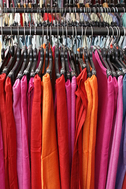 istock Pastel colored scarves on hangers 118111586