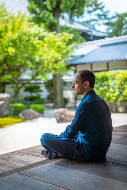 istock Caucasian men relaxing in temple garden 1181120828