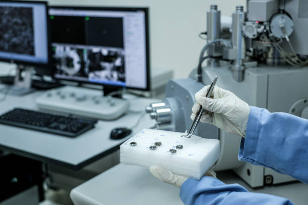 istock Scientist is preparation of nanomaterials for Scanning Electron Microscope (SEM) machine and blur computer controller background in laboratory 1181122303