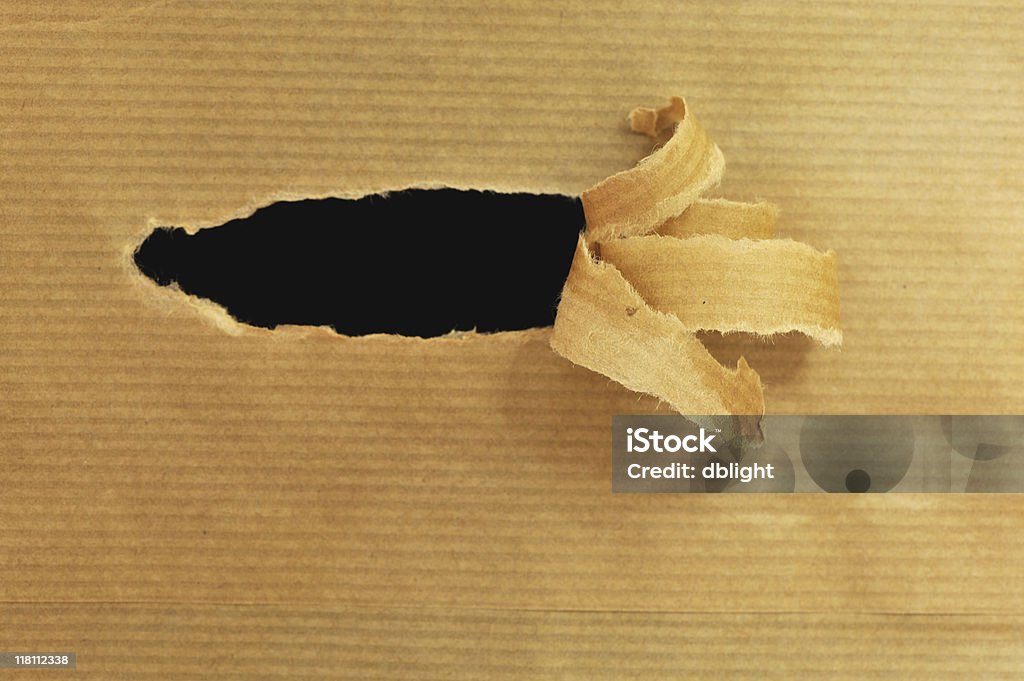 茶色の紙のピーリング - のぞき穴のロイヤリティフリーストックフォト