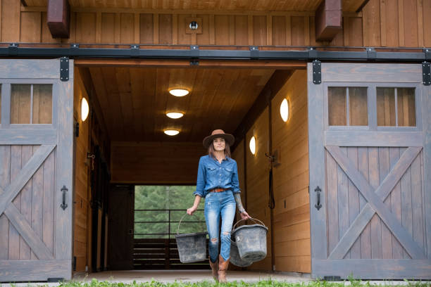 istock Female rancher working at the ranch 1181124996
