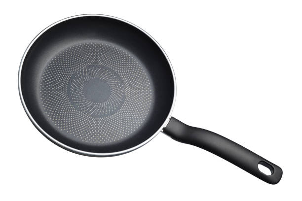 istock Black teflon skillet with non-stick coated surface isolated 1181127047